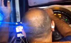 Direksiyon başında video izleyen minibüs şoförü kamerada