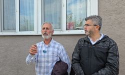 Evinin yıkımına engel olmak için benzin bidonuyla çatıya çıktı