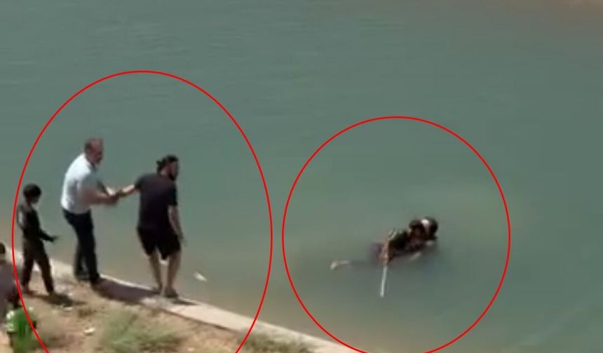 Akıntıya kapılan 2 kişiyi halat ve çekpasla sudan çıkardılar